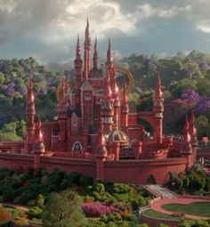 an aerial view of a castle in the middle of trees and bushes, with clouds overhead