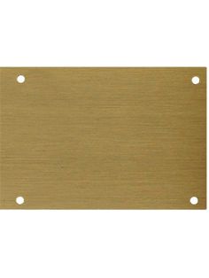 a brass metal plate with holes in the middle