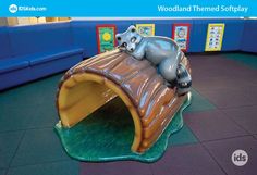 This photo shows an interactive indoor kids' playground that can be found inside malls, theatres, hospitals, daycares, schools, churches and more. This is a hand sculpted, hand painted foam sculpture created and designed by artisans. It features adorable woodland creatures including a racoon that makes it family-friendly, kid-friendly and great for photo opportunities. Kids Ministry, Indoor Playground, Themed Decor, Children's Ministry, Interactive Activities, Artisan Design