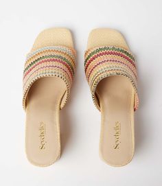 Conquer your day with ease with these raffia slides that strike the perfect balance between a walkable heel height and on-trend style. This design features padded OrthoLite Hybrid insoles and a patented down curve, ensuring a natural and comfortable stride with arch support. The raffia material adds a hint of texture and a bohemian charm, making these sandals a versatile addition to your wardrobe. Raffia upper Heel height: 2 3/4 inches Imported True to size Seychelles | Karen Kane Adapt Raffia H Multicolor Round Toe Mules For Summer, Multicolor Open Toe Mules For Summer, Trendy Multicolor Mules For Spring, Multicolor Flat Mules For Summer, Summer Multicolor Flat Heel Mules, Trendy Multicolor Mules For Summer, Casual Multicolor Open Toe Mules, Trendy Multicolor Summer Mules, Multicolor Slip-on Beach Mules