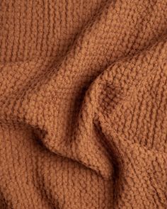 an image of a brown blanket that is made out of knitted wool and fabric