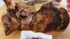 a piece of meat on a cutting board with a fork