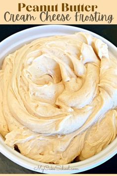 a white bowl filled with cream cheese frosting