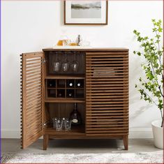 a wooden cabinet with wine glasses on it