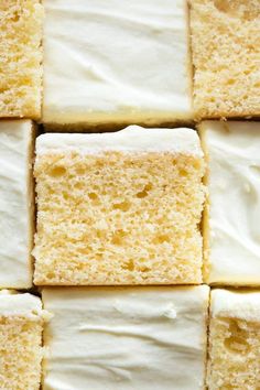 several pieces of cake sitting on top of each other with white frosting in the middle