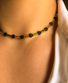 BLACKNGOLD LupusJewelryGR black and gold beaded hematite choker necklace gold bar matte seashell healing stone luxury beach accessories gift by LupusJewelryGR on Etsy Santorini Sunset, Choker Necklace Gold, Gold Bars, Gold Bar Necklace, Gold Choker Necklace, Beach Accessories, Gold Bar, Beaded Necklaces, Healing Stone