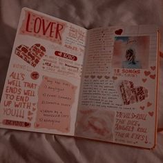 an open book with lots of stickers and writing on the pages that read lover