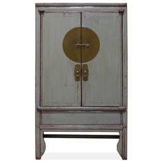 This beautiful elmwood armoire is inspired by traditional Chinese wedding cabinets and is a perfect addition to any modern bedroom. The cabinet features Ming-style brass plate hardware and a blue and white prosperity tassel, giving it a zen-infused look. The double-door compartment has two removable shelves and a top hanging pole, while the bottom wooden planks hide a secret alcove that's perfect for storing linens and clothes.   Crafted entirely of solid elmwood lumber using traditional Chinese Armoire Decor, Wedding Cabinet, Bay Window Living Room, Asian Furniture, Painted Chair, Inspired Bedroom, China Furniture, Gray Wedding, Chinese Furniture