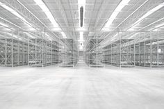 an empty warehouse filled with lots of shelves