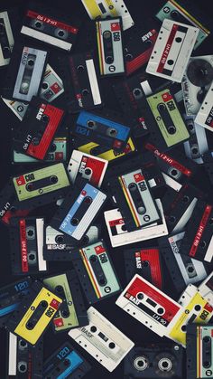 an apple logo is surrounded by cassettes and tape recorders that are all over the place