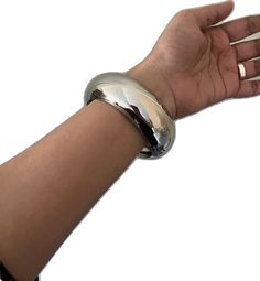 Trendy Metal Cuff Bracelet, Trendy Silver Bangle Bracelet, Modern Metal Cuff Bangle, Polished Wide Band Cuff Bracelet, Polished Metal Jewelry With Thick Band, Modern Thick Band Silver Bracelet, Modern Silver Bracelet With Thick Band, Polished Metal Cuff Bangle, Metal Cuff Bangle With Polished Finish