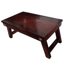 a wooden coffee table with two legs and a brown stain on the top, against a white background