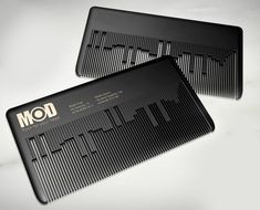 two black combs sitting next to each other