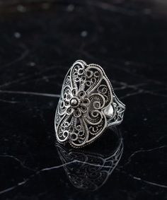 Sterling Silver Boho Filigree Lace Women Ring, Artisan Handmade Floral Statement Ring, Handmade Ornate Goth Jewelry, Birthday Gift for Her Anniversary Gift, Dainty Nature Jewelry Ring, Garden ring, victorian flower ring, women statement ring, ring gift for mom Material: 925 Sterling Silver ( NICKEL FREE ) FAST AND TRACKABLE SHIPPING FOR ALL EU COUNTRIES AND USA. COMES WİTH VELVET POUCH AND LUXURY GİFT BOX. The Sterling Silver Boho Filigree Lace Women Ring you mentioned sounds like a beautiful and intricate piece of jewelry. It is described as an artisan handmade floral statement ring with ornate gothic elements, making it a unique and stylish choice. This type of ring is often associated with bohemian and boho-chic fashion styles, characterized by a free-spirited and eclectic aesthetic. Th Artistic Jewelry With Intricate Design For Gift, Handmade Vintage Filigree Ring, Oxidized Finish Filigree Ring For Gift, Artistic Intricate Wedding Jewelry, Bohemian Filigree Ring With Oxidized Finish As Gift, Vintage Oxidized Filigree Ring Gift, Handmade Adjustable Ornate Filigree Ring, Handmade Bohemian Filigree Ring, Ornate Handmade Ceremonial Rings