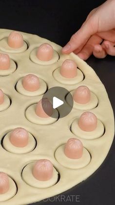 an image of doughnuts being made in the shape of circles on a table