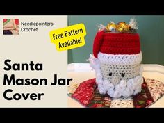 a crocheted santa mason jar cover is shown