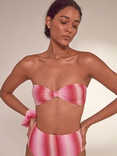 The Feven Fuchsia swim collection features a new stretchy fabric with striped and ombre design in white, soft pink, and raspberry. A unique twist on the classic scrunch fabric for a youthful and vintage look. This bandeau top is a truly versatile swimsuit option to pair with any bikini bottom. The top features a removable halter strap and bust tie for multiple styling options. It features a new stretchy fabric for a playful look. Responsibly-made in Morocco, this style is made in an Oeko-Tex® ce Pink Bandeau Beachwear Swimwear, Chic Pink Strapless Swimwear, Chic Pink Stretch Swimwear, Ombre Design, Rib Fabric, Halter Strap, Swim Suits, Caftan Dress, Dress Robes