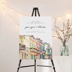 an easel with a sign that says welcome to the wedding of george and elizabeth