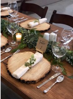 the table is set with place cards and silverware