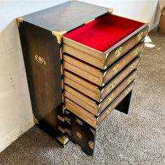 a large stack of books sitting on top of a floor next to a white wall