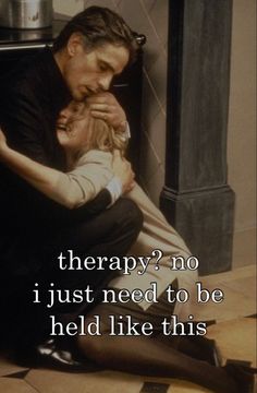 a man sitting on the floor with a baby in his lap and a quote about therapy