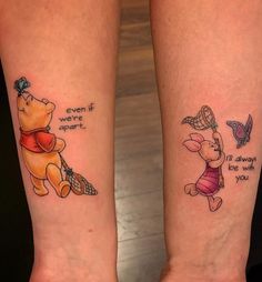 two winnie the pooh tattoos on both legs, one is saying even if they were not