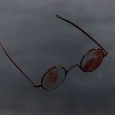 a pair of glasses that are sitting in the water