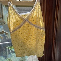 Wild Love Lg Beautiful Yellow Tank Top With Tiny White Daisies On It! Never Worn. Lace Detail And Spaghetti Straps. Really Feminine And Soft. Cute Yellow Sleeveless Top, Summer Yellow Camisole With Spaghetti Straps, Yellow Summer Camisole, Yellow Cotton Camisole, Yellow Spaghetti Straps Summer Camisole, Yellow Sleeveless Top With Lace Trim, Yellow Lace Trim Sleeveless Top, Yellow Summer Camisole Top, Yellow Camisole Summer Tops