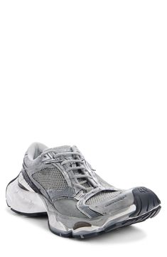 More the cliché than the craftsmanship meaning of 'cobbled' appears to apply to this sneaker with a rebuilt-on-the-fly look featuring scuffs and smudges and haphazardly placed staples all around the upper. Lace-up style Textile and synthetic upper/textile lining/rubber sole Imported Designer Shoes Silver Sneakers With Rubber Sole For Light Sports, Silver Sneakers With Rubber Sole For Streetwear, Classic Silver Sneakers For Light Sports, Silver Low-top Running Shoes With Rubber Sole, Classic Silver Sneakers With Boost Midsole, Silver Custom Sneakers With Rubber Sole For Streetwear, Custom Silver Sneakers With Rubber Sole For Streetwear, Silver Custom Lace-up Sneakers With Rubber Sole, Custom Silver Lace-up Sneakers With Rubber Sole