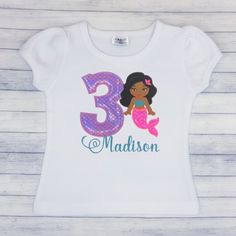 Mermaid Birthday Shirt, Girls Mermaid Birthday Shirt, Embroidered Birthday Shirt, Embroidered Shirt, Age 1-9, Personalized embroidered T-shirt. The design on the t-shirt is embroidered which means it is stitched into the shirt for durability and great quality.This is a boutique quality t-shirt.'The shirt runs true to size.A soft protective covering is used on the inside of all children’s shirts to protect sensitive skin.Washing instructions:-Machine wash cold and hang to dry or lay flat. White Embroidered Tops For Birthday, White Embroidered T-shirt For Birthday, Pink Embroidered Top For Birthday Party, Embroidered Crew Neck Birthday T-shirt, Embroidered Pink Tops For Birthday, Pink Embroidered Top For Birthday, Embroidered Crew Neck T-shirt For Birthday, Embroidered Birthday T-shirt, Birthday Girl Shirt