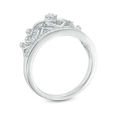 Certain to delight, this regal diamond crown ring is a loving tribute to the queen of your heart. Crafted in sterling silver, this detailed design features open hearts and sparkling diamonds. At its base, the style showcases a "headband" of shimmering diamonds. Captivating with 1/6 ct. t.w. of diamonds and a bright polished shine, this ring proclaims her sophisticated look. Custom-made to fit her ring size. Sterling silver rings cannot be resized after purchase. Classic Diamond Ring With Crown Design For Formal Occasions, Regal Diamond Jewelry For Anniversary, Classic Formal Diamond Ring With Crown Design, Crown Shaped Diamond Ring For Anniversary, Classic Crown Design Diamond Ring For Formal Occasions, Formal Crown Design Diamond Ring, Wedding White Gold Rings With Crown Design, Diamond Crown Rings For Anniversary, Formal White Gold Diamond Ring With Crown Design