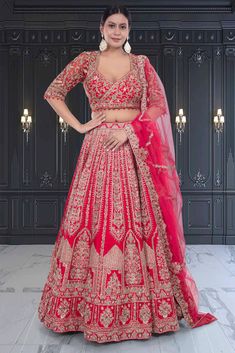 This bridal lehenga, BL-280, features a striking red color with intricate gold embroidery. Made from high-quality materials, it exudes luxury and elegance. The bold color and detailed embroidery make it a perfect choice for traditional weddings. Upgrade your bridal look with our exquisite BL-280 lehenga. Lehenga Fabric, Traditional Weddings, Indian Bridal Lehenga, Detailed Embroidery, Indian Lehenga, Bridal Look, Gold Embroidery, Bold Color