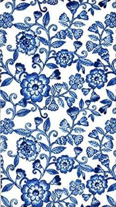 a blue and white flowered pattern on fabric