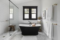 a black and white bath tub in a bathroom