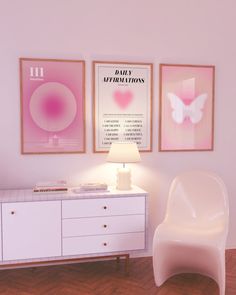 a white chair sitting next to a dresser in a room with posters on the wall