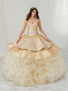 All eyes will be on you in this strapless charro ball gown with A-line ruffled skirt by House of Wu LA Glitter 24082. Make a bold statement in this gorgeous sweetheart neckline three-piece ball gown. The bodice is accented with corset boning, beaded appliques and the neckline is trimmed with beaded lace. Note: Matching bolero jacket Style #24082J is sold separately for $100 USD. House of Wu LA Glitter Designers Collection: Fall 2021 Style Number: 24082 Fabric: Mikado/Organza/Tulle Colors: Champa Quinceañera Dresses, Charro Quinceanera Dresses, Military Ball Dresses, Champagne Dress, Quinceanera Dress, Illusion Dress, Ruffled Skirt, Sweetheart Dress, Junior Bridesmaid Dresses