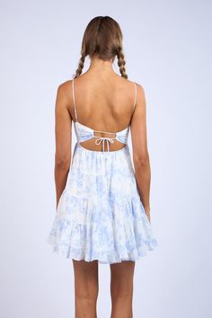 Be ready for your next event in the flirty Allie White and Blue Floral Babydoll Mini Dress! White and blue floral cotton fabric creates adjustable spaghetti straps and a bustier bodice with a sweetheart neckline that wraps around to an open back with cutout detail. Set-in waist sits above a tiered lightweight mini skirt with a ruffle hem. Hidden side zipper. DETAILS & CARE Fit Fit Type: Regular Waist Line: High Rise Chest Pad: No Padding Lining: Partially Lined Length: Mini Neckline: Cami Straps Tiered Babydoll Dress, Floral Bustier, Babydoll Mini Dress, Mini Dress White, Pink Boho, Girl Style, Sierra Leone, Guinea Bissau, Chest Pad