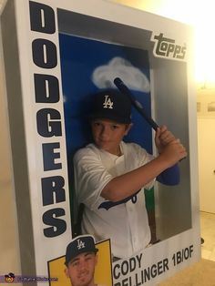 a cardboard cutout of a baseball player holding a bat and posing for the camera