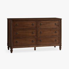 a wooden dresser with many drawers and knobs on the bottom drawer, against a white background