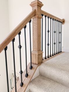 an image of a stair railing in a house or office area with carpeted flooring