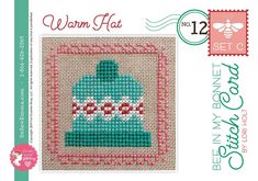 a cross stitch pattern with the words warm hat and a blue bell on it's side