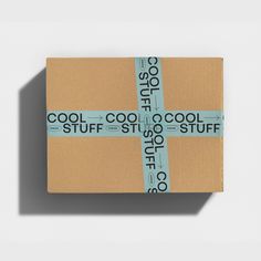 a wrapped gift box with the words cool stuff on it