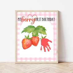 a pink gingham background with two strawberries and the words my berry first birthday