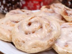 glazed cinnamon rolls on a white plate