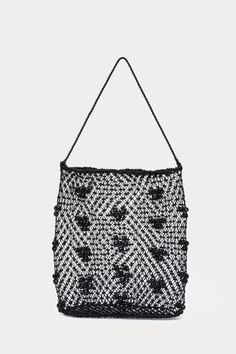 Slouchy shoulder bag crafted from intricately woven leather and bamboo beads. 100% Leather, 100% Bamboo Beads Length: 12.25" Width: 10" Shoulder Strap Length: 20.5" Made in India Everyday Beaded Crochet Tote Bag, Bohemian Handwoven Evening Bags, Handwoven Crochet Tote Bag For Evening, Evening Handwoven Tote Crochet Bag, Evening Handwoven Crochet Tote Bag, Bohemian Black Beaded Shoulder Bag, Bamboo Beads, Creative Class, Neon Purple