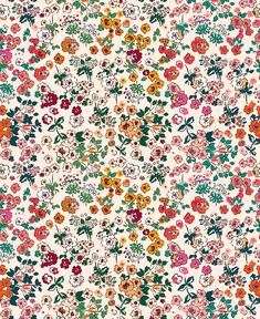 colorful floral pattern on white background with lots of small flowers and leaves in the center