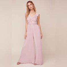 Astr Golden Hour Plisse Jumpsuit In Lilac Features A Romantic Plisse Construction With A Plunge Neckline That Leads To A Twist-Front Bodice And Cutout Accent, Wide Leg Pants And Short Ruffle Sleeves Finish This Chic Style. Feminine V-neck Jumpsuits And Rompers For Night Out, Feminine Sleeveless Jumpsuits For Night Out, Feminine Evening Jumpsuits And Rompers For Spring, Feminine V-neck Jumpsuit For Night Out, Feminine Summer Jumpsuits And Rompers For Evening, Feminine Summer Evening Jumpsuits And Rompers, Feminine Summer Evening Jumpsuit, Chiffon Romper, Crochet Romper