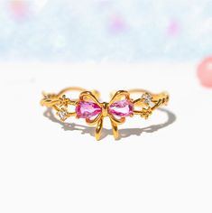 This ring will get you feeling extra pretty in pink! Wrap yourself up in a bow and celebrate the greatest present there is--you! Featuring a delicate intertwining band and dazzling embellishments, all leading to a perfect pink ribbon. This piece will make you feel like the ultimate gift! Future Engagement Rings, Pink Wrap, Flat Back Earrings, Handmade Jewelry Tutorials, Bow Ring, Birthday Ring, Necklace Chain Lengths, Perfect Pink, Cute Rings