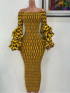 Thank you for shopping by! Beautiful African print elasticated bodycon is extremely flattering for all beautiful body types. made out of 100% cotton African print. The elastic thread was sewed to fabric which makes it very stretchy. length 53inches long. Very puffy sleeves with elastic at the end. DISCLAIMERFabric placement may vary from the pictured item due to the irregular patterned nature of African fabrics. And also fabric color may vary depending on your device. Choosing the right size gives us the confidence to deliver the best perfect fit for you, so do well to contact me if you have any challenges choosing a size also advise if you have your measurements, kindly send them to me and I will gladly use that to fix for you. Thanks for visiting! Chic Stretch Dresses With Elastic Shoulders, Fitted Cotton Midi Dress With Gathered Sleeves, Fitted Multicolor Ruched Maxi Dress, Trendy Fitted Dress With Elastic Sleeves, Party Fitted Maxi Dress With Elastic Sleeves, Fitted Cotton Midi Dress With Ruffles, Stretch Ruffled Maxi Dress, Stretch Maxi Dress With Ruffles, Fitted Midi Dress With Elastic Shoulders