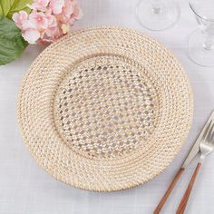 a place setting with silverware and flowers